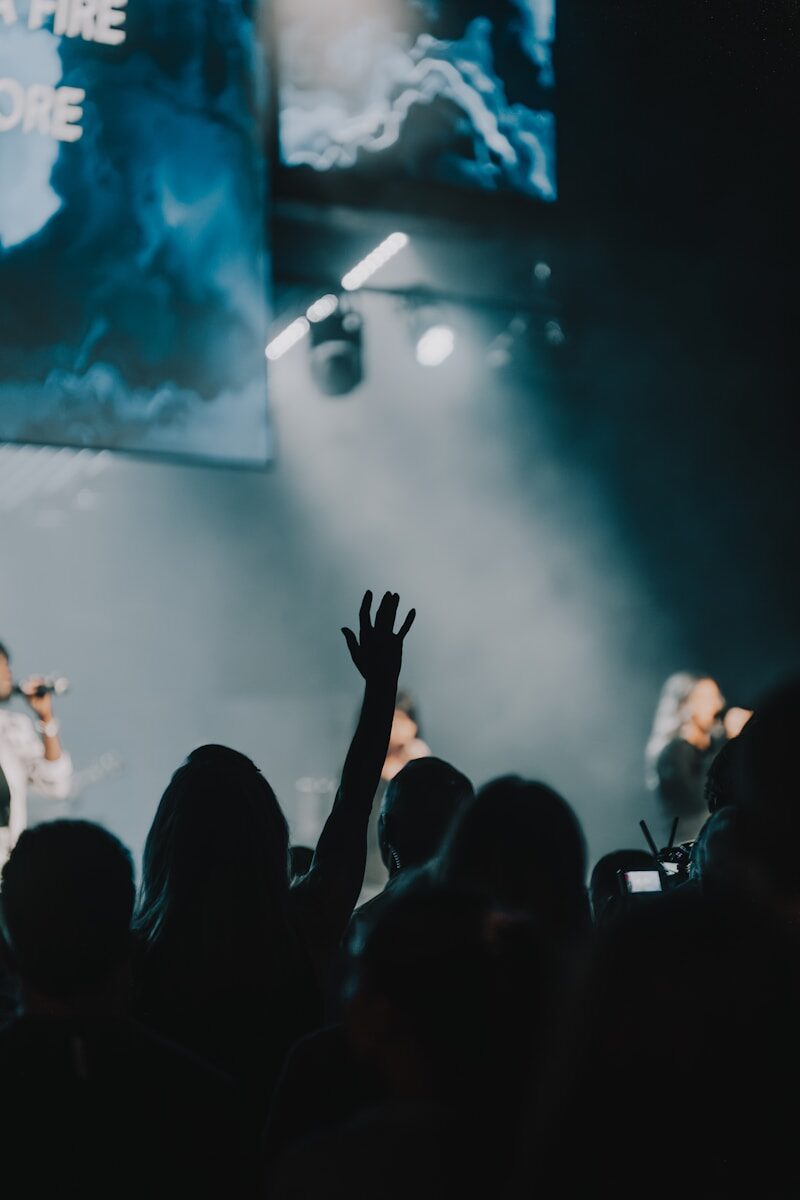 a group of people standing on top of a stage